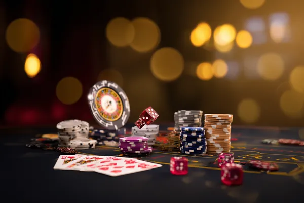 A confident dealer surrounded by casino chips inviting players to access their TK555 account, reflecting quick and easy login options.